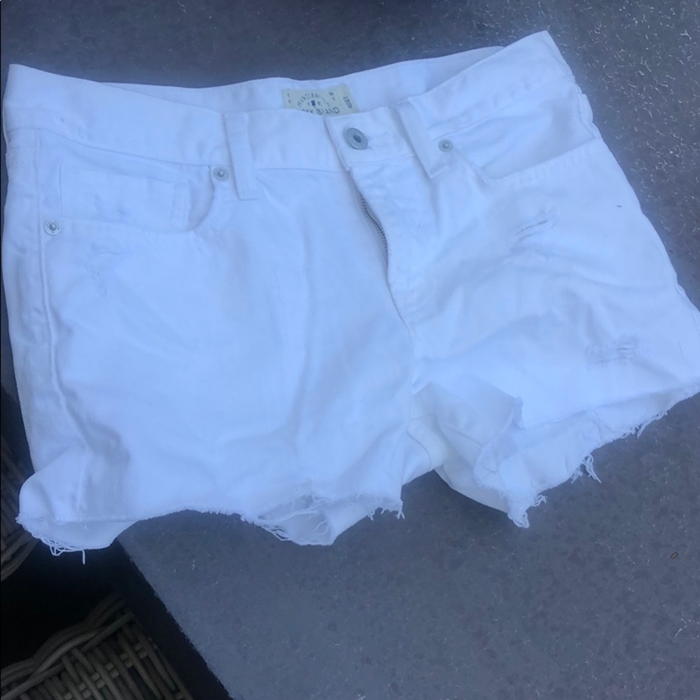Cut off white shorts distressed